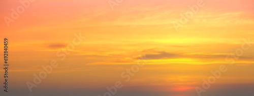 Enjoy a panoramic view of the skyline. The sun rises in the morning sky with colorful clouds. and beautiful cloud patterns In the soft light of the morning