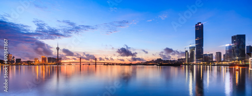 Zhuhai and Macau city skyline with modern buildings scenery at dusk, China. Famous coastline and city buildings in China. photo