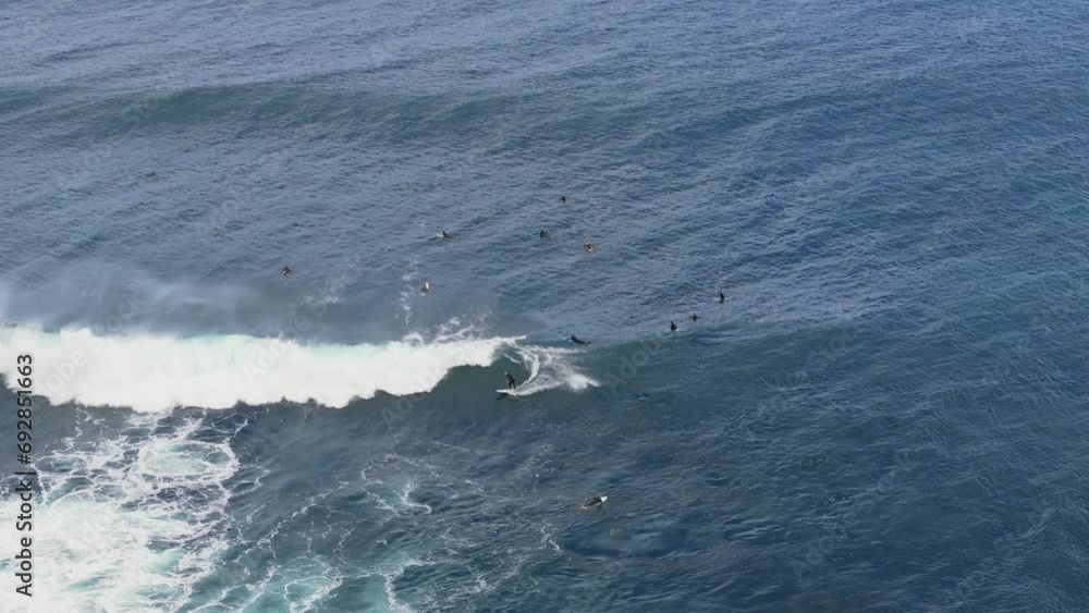 Aerial top down view of surfer catching break in Margaret River, Western Australia Aerial top down view of surfer catching break in Margaret River, Western Australia