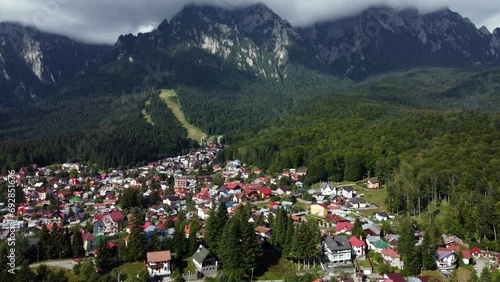 Romanian Carpathian area captured by drone, old village in the foreground photo