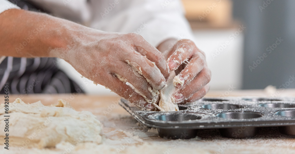 professional Chef sifting flour powder and sprinkling ingredients on massaging dough for bakery cooking. Chef show dirty finger hand sifting flour wheat and kneading dough mixing powder. professional Chef sifting flour powder and sprinkling ingredients on massaging dough for bakery cooking. Chef show dirty finger hand sifting flour wheat and kneading dough mixing powder.