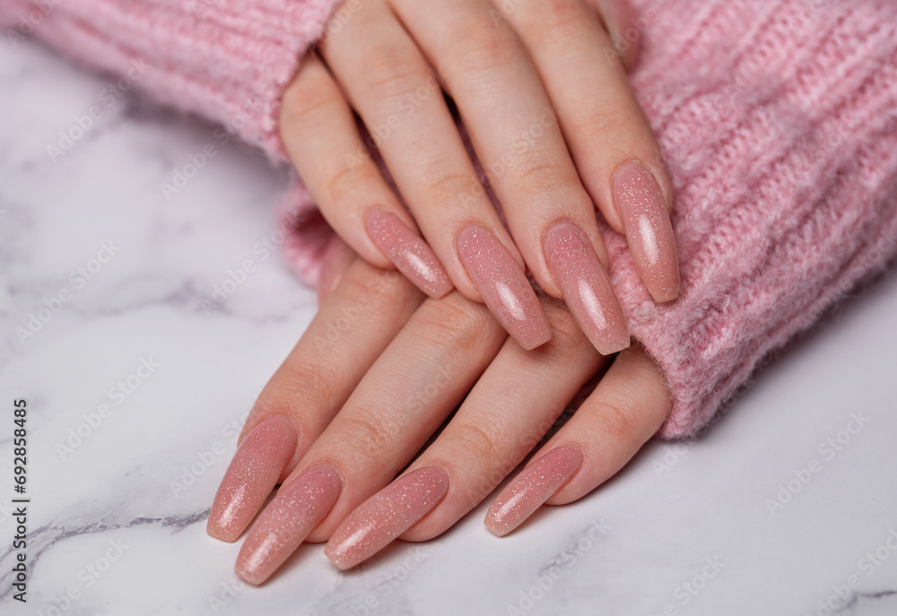 Female hands with pink nail design Female hands with pink nail design
