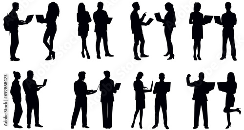 silhouettes of group people working on laptop.  standing business people set vector 