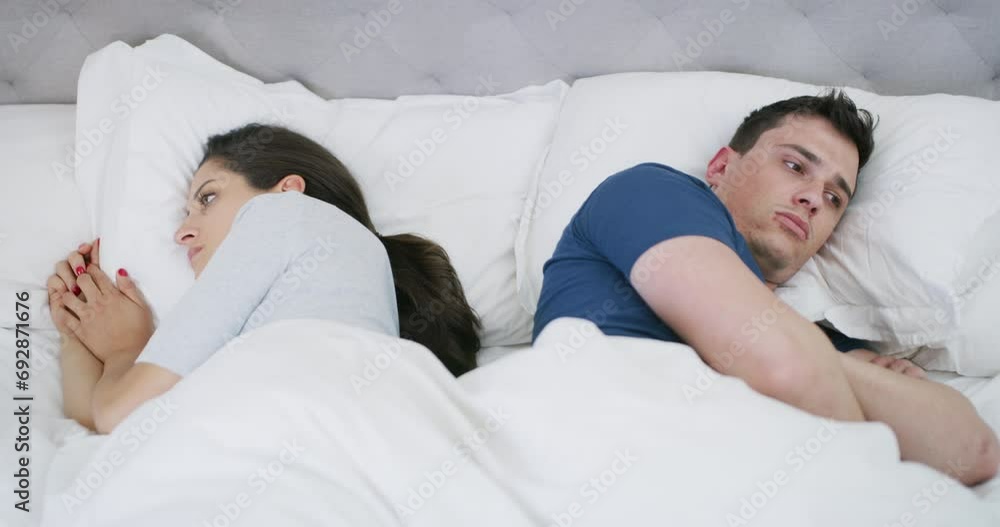 Conflict, ignore and couple in bed for argument, divorce and fighting for marriage problem in home. Relationship, emotional and upset man and woman in bedroom for crisis, cheating and frustrated