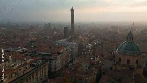 Towers of Bologna, Italy - Two Leaning Towers. Forward Drone Shot at Sunrise. Asinelli and Garisenda Towers. photo