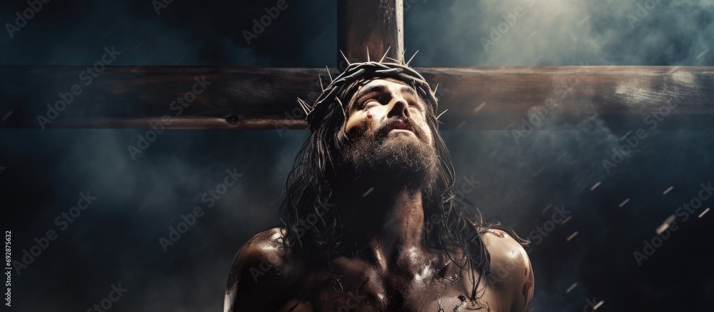 Jesus Christ crucified, representing Christian suffering. - obrazy, fototapety, plakaty 