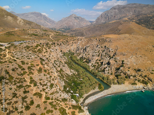 Aerial view of beautiful natural tourist attraction Preveli palm tree forest gorge in Crete Greece, Rethymno area,