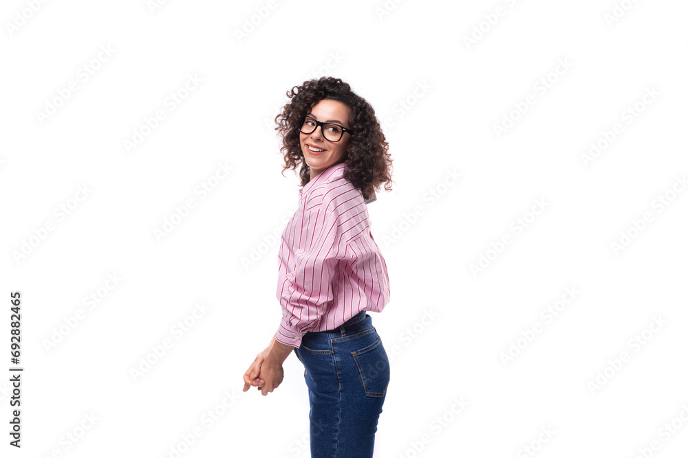 young slender caucasian woman with a curly haircut is dressed in a striped shirt young slender caucasian woman with a curly haircut is dressed in a striped shirt