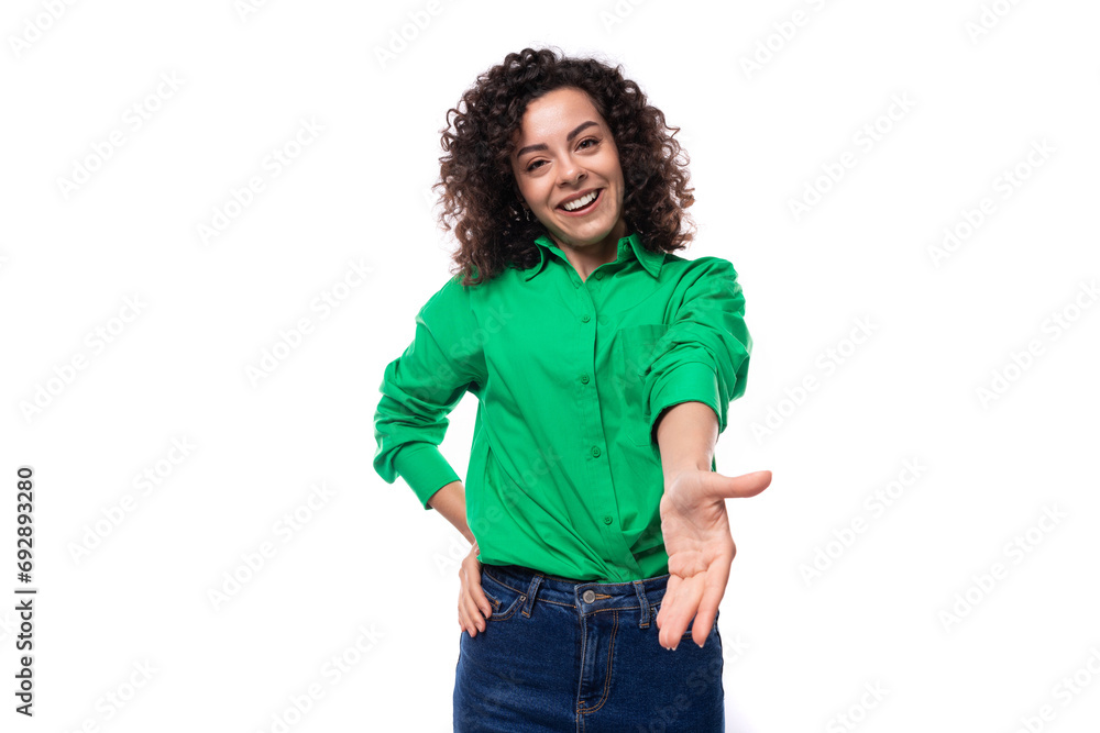 young cheerful woman with stylish hair styling by curly method dressed in a green shirt on a white background with copy space young cheerful woman with stylish hair styling by curly method dressed in a green shirt on a white background with copy space