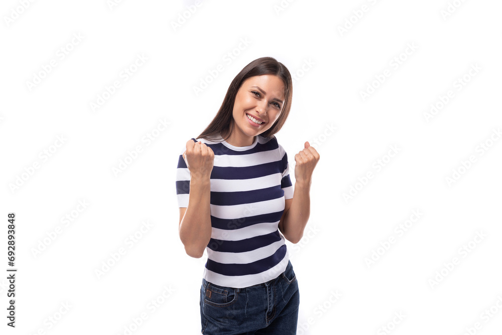 young lucky happy brunette woman with straight hair dressed in a striped t-shirt young lucky happy brunette woman with straight hair dressed in a striped t-shirt