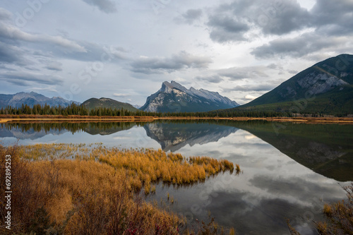 Majestic panoramic view over Vermilion lakes near Banff, Canada with fall and reflection in the lake 