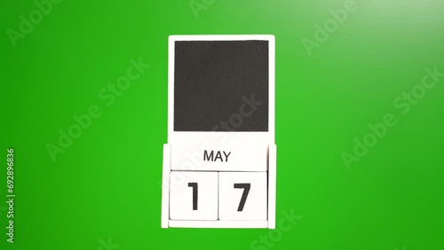 Calendar with the date of May 17 on a green background. Illustration for an event of a certain date. photo