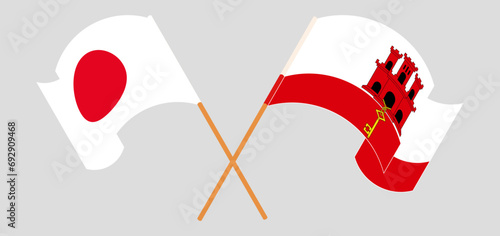 Crossed and waving flags of Japan and Gibraltar