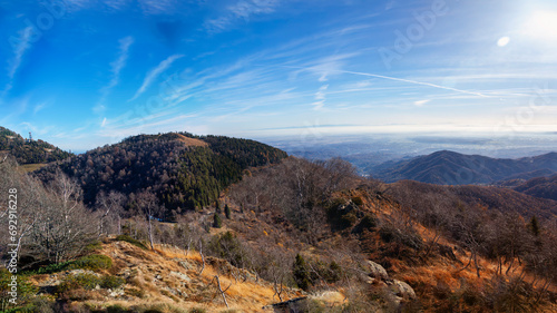 Winter panorama of the mountains surrounding the wilderness area of Valdilana. Is a natural parkland in the Biella Province (Northern Italy, Piedmont Region), and renowned ski area. photo