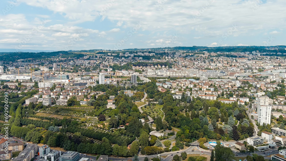 Lausanne, Switzerland. Panorama of the city and view of the Bois de Vaux Cemetery. Located on the shores of Lake Geneva. Summer day, Aerial View