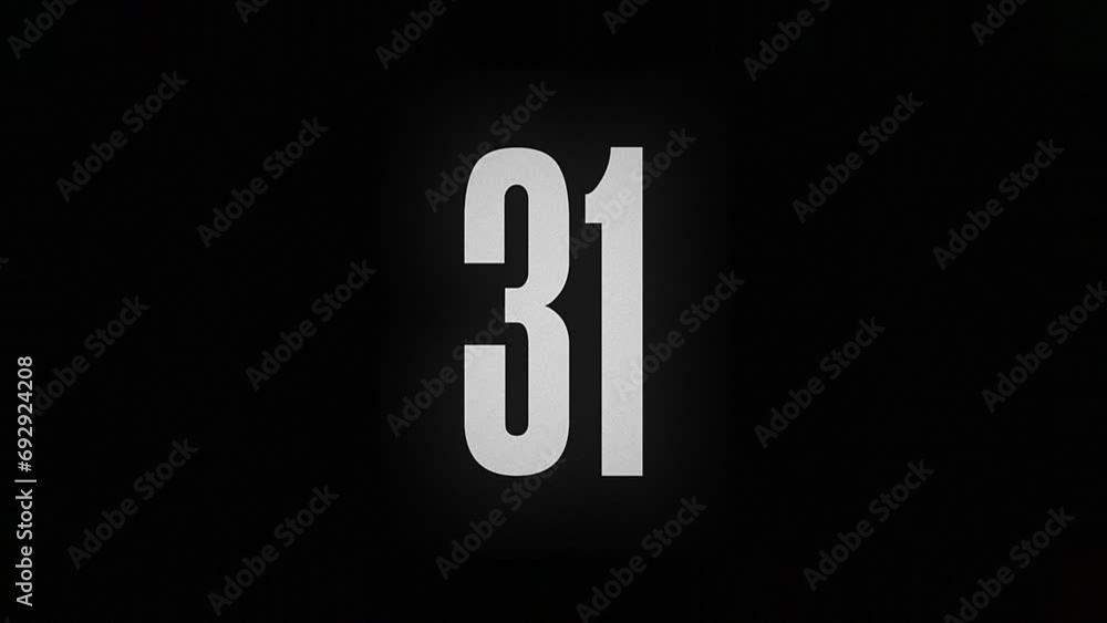 The number 31 smolders and burns on a black background, the number is on fire The number 31 smolders and burns on a black background, the number is on fire