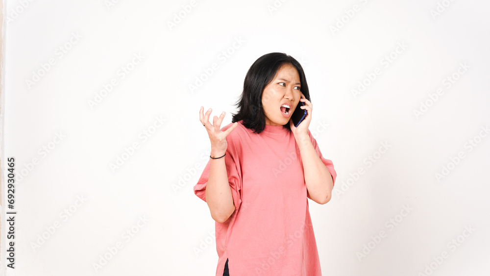 Angry asian woman talking on the phone. Isolated on white background. Angry asian woman talking on the phone. Isolated on white background.