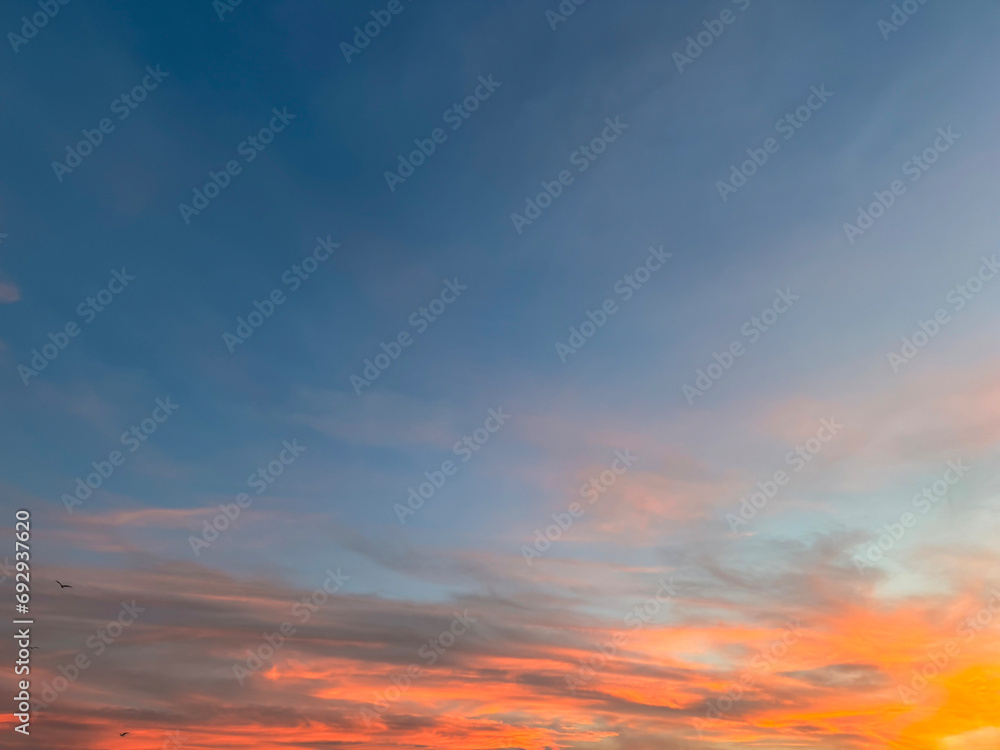 Dramatic sunset sky with colorful clouds background concept. Evening sunset. Twilight sky.
