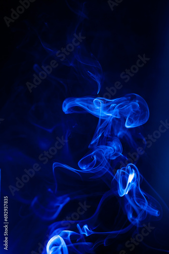Blue smoke motion on black background.