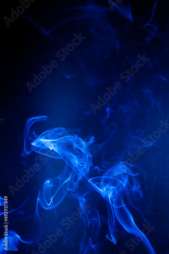 Blue smoke motion on black background.