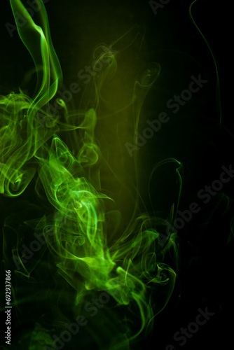 Green smoke motion on black background.
