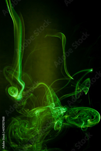 Green smoke motion on black background.