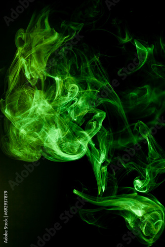 Green smoke motion on black background.
