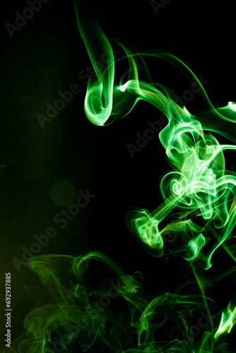 Green smoke motion on black background.