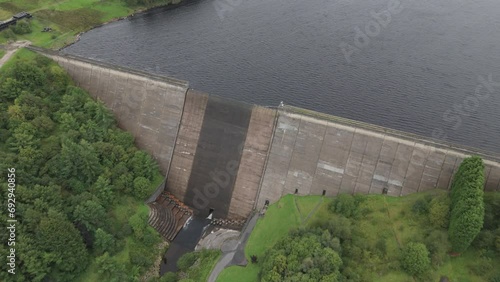 Booth wood reservoir aerial view flyover of concrete dam spillway and fresh water lake, West Yorkshire photo