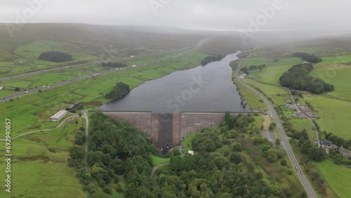 Booth wood reservoir aerial view circling above the concrete lake dam and M62 motorway photo