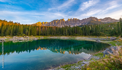 Lake Carezza in Val d'Ega, Mermaid legend gives it rainbow hues. Changing depths, frozen charm in winter