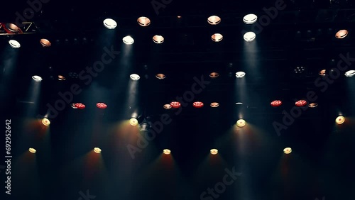Atmosferic stage light from spotlights lightning and flashing during the concert or show photo