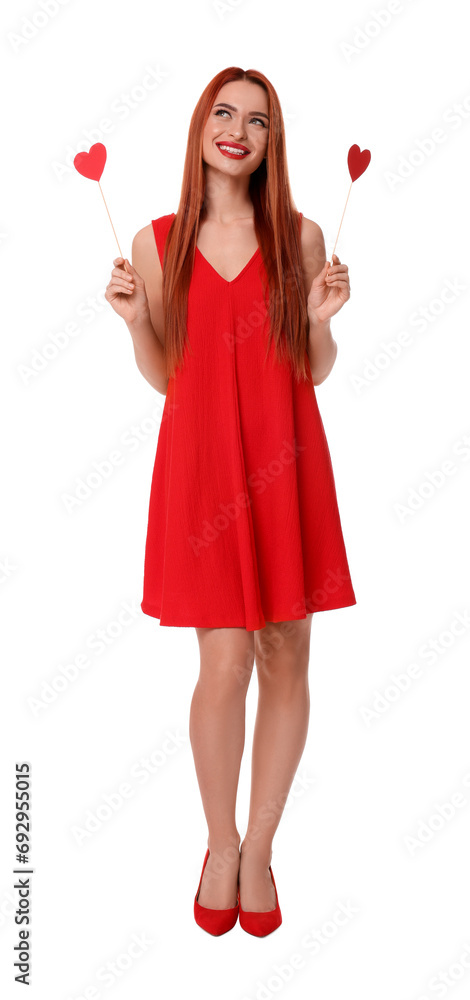 Young woman in red dress with paper hearts on white background Young woman in red dress with paper hearts on white background