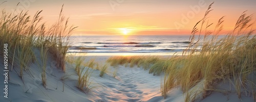 Capturing beauty of coast. Sunset at beach. Sun dips below horizon casting warm glow on sand dunes and gentle waves. Idyllic seascape with calm waters and colorful sky invites reflection and peace photo