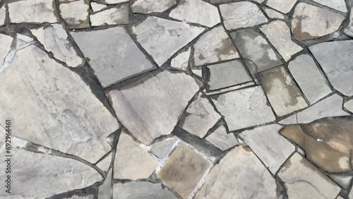 View of pavement tiles, old road, background
