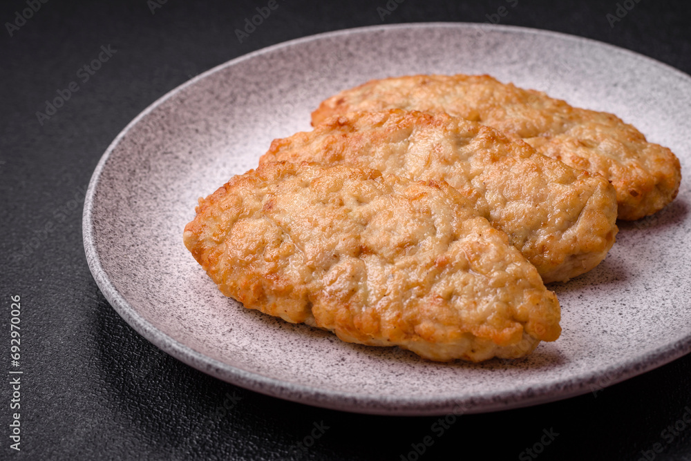 Delicious fresh fried minced fish or chicken cutlets with spices and herbs Delicious fresh fried minced fish or chicken cutlets with spices and herbs