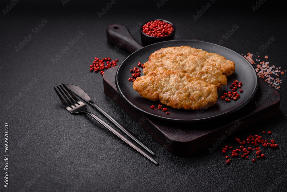 Delicious fresh fried minced fish or chicken cutlets with spices and herbs Delicious fresh fried minced fish or chicken cutlets with spices and herbs