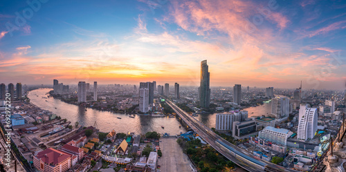 Fototapeta Naklejka Na Ścianę i Meble -  Aerial view of Bangkok city with Chao Phraya river curve during sunset