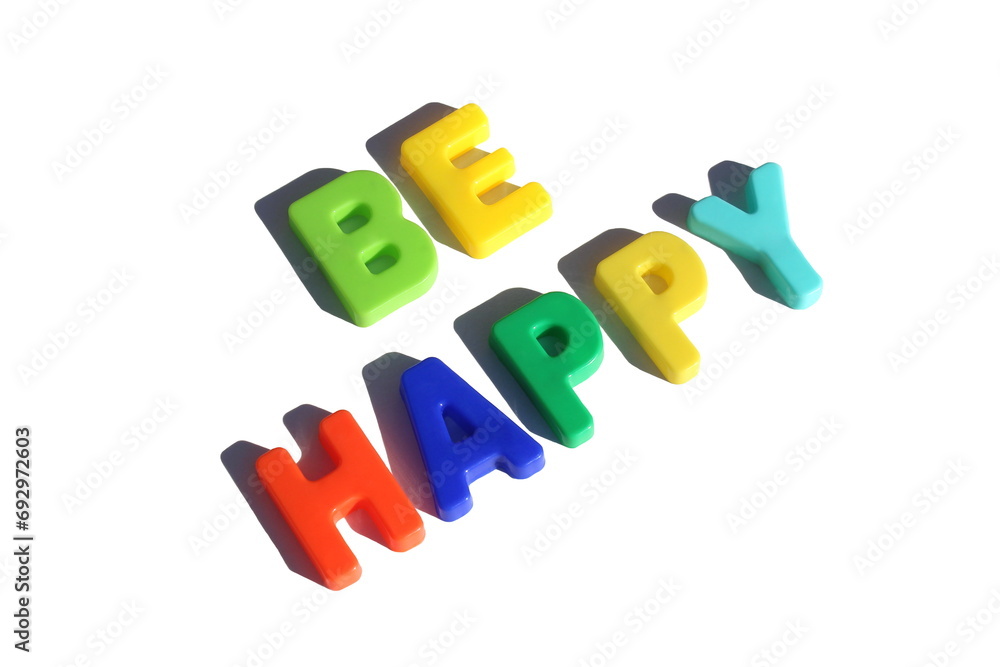 The word “Be happy” is laid out in bright multi-colored letters on a white background. The word “Be happy” is laid out in bright multi-colored letters on a white background.