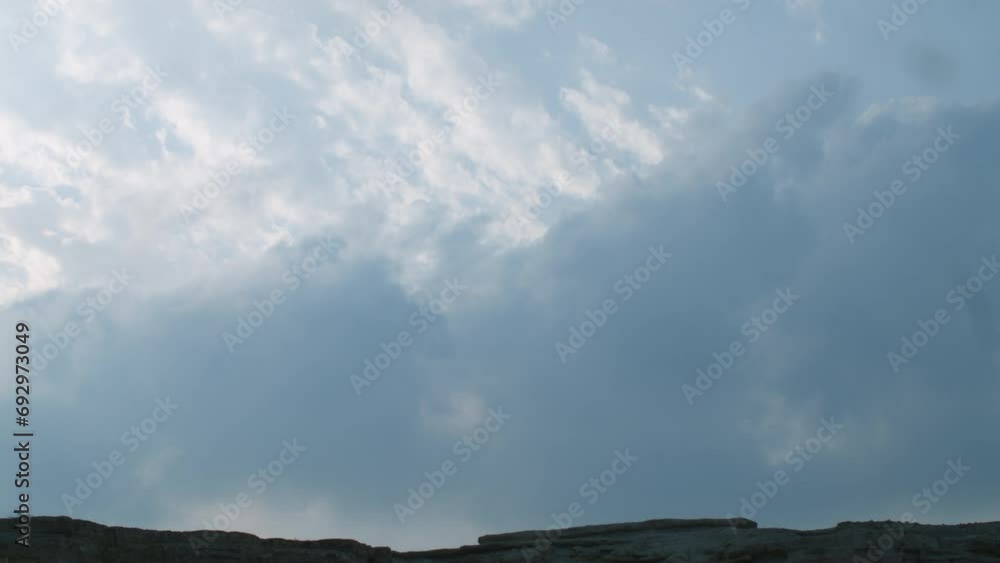 Thick clouds over rock formations under threat of demolition, Riffa, Al Janūbīyah, Bahrain. Thick clouds over rock formations under threat of demolition, Riffa, Al Janūbīyah, Bahrain.