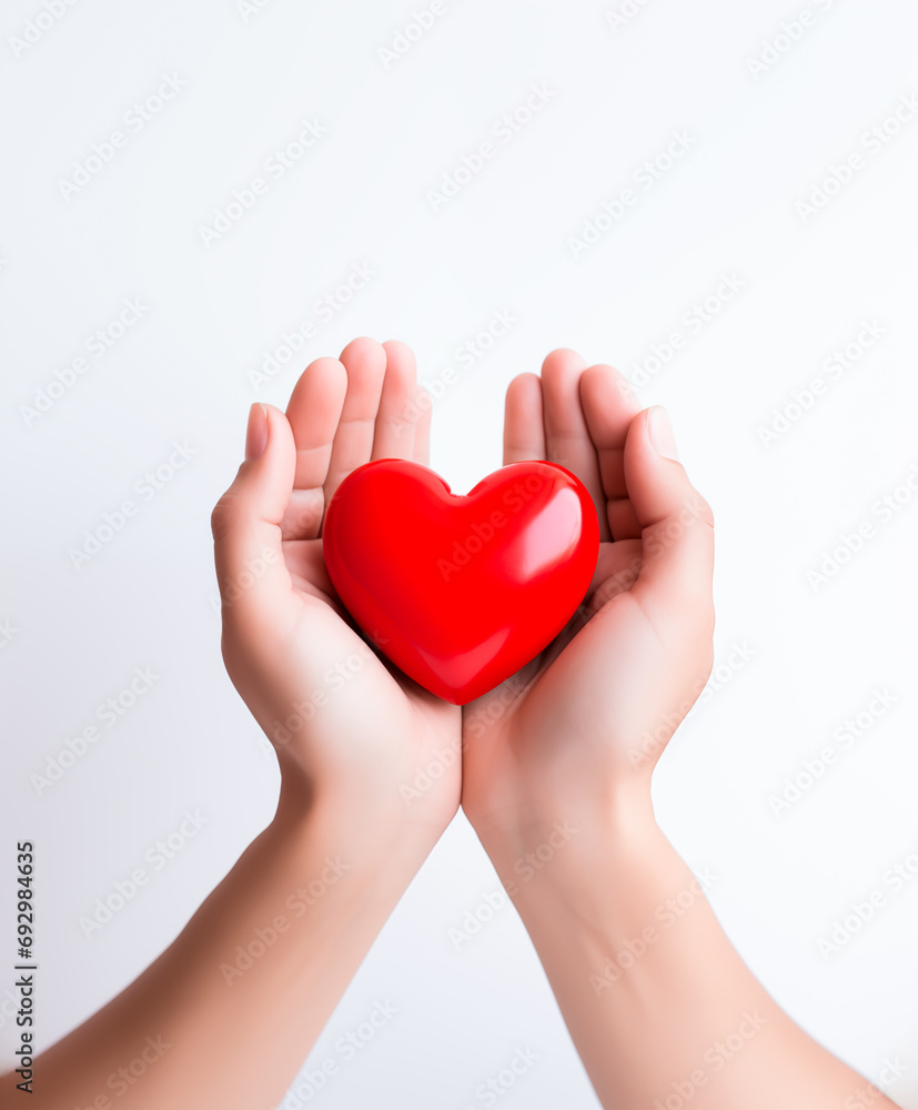 Hands cradling red heart, symbol of care and love. Valentines Day concept. Copy space.
Hands cradling red heart, symbol of care and love. Valentines Day concept. Copy space.