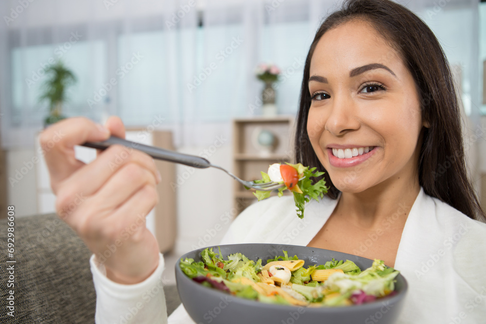 beautiful fit woman eating healthy salad after fitness workout beautiful fit woman eating healthy salad after fitness workout