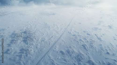 Aerial landscape of the road through snowy field © Riya