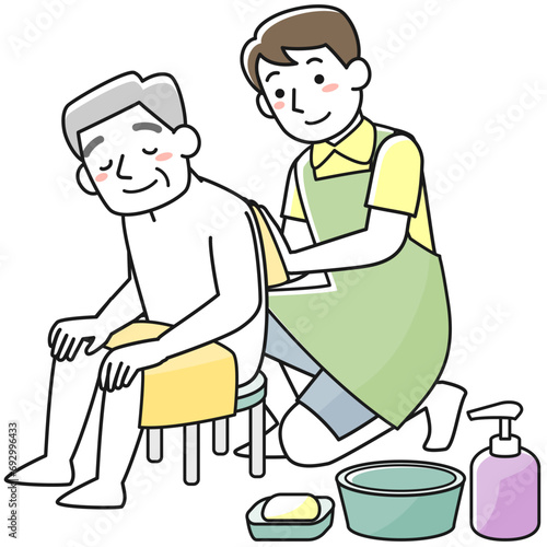 シニア男性の入浴介助をする男性職員