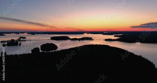 Aerial view of finnish lake vanaja and bridge during sunset in summer. Sunset reflections in the water. golden hour in finnish nature. photo