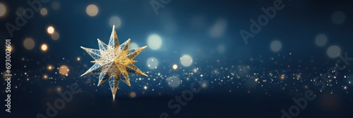 Abstract glowing golden star on dark blue night background. Christmas golden light shed bokeh particles over a background, new year 2024 banner photo