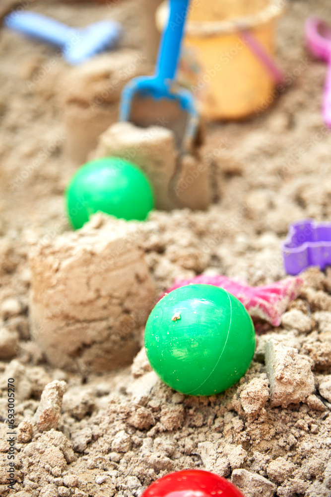 Children's sandbox with various toys for the game in summer day Children's sandbox with various toys for the game in summer day