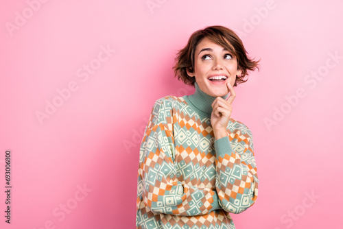 Photo of think cute feminine lady young age finger touch chin wearing xmas print sweater look mockup idea isolated on pink color background