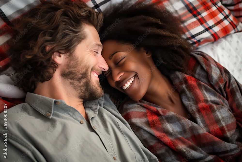 Obraz premium Playful Multicultural Couple Embracing in Modern Home
