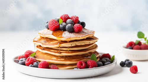 Wallpaper Mural Pancake Day - Blueberry and Raspberry Pancakes with Maple Sirup or Honey. Blurred White Background. Happy Pancake Day. Torontodigital.ca